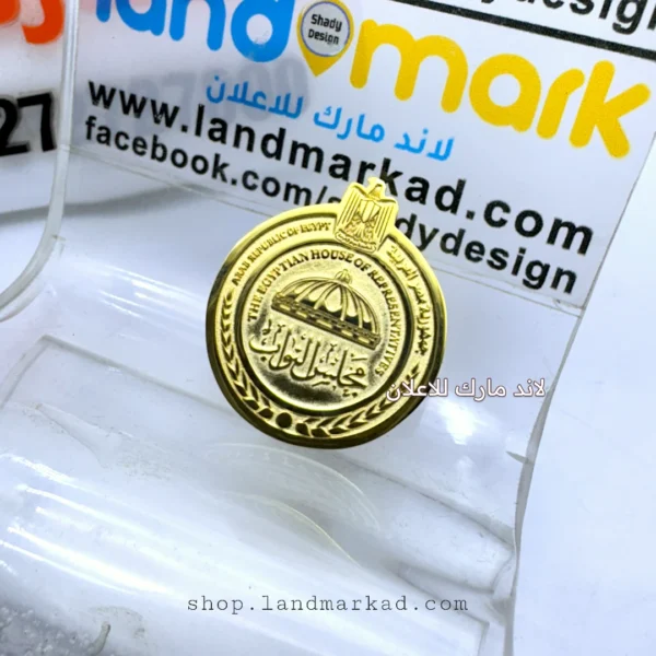 A suit pin with the logo of the Egyptian House of Representatives